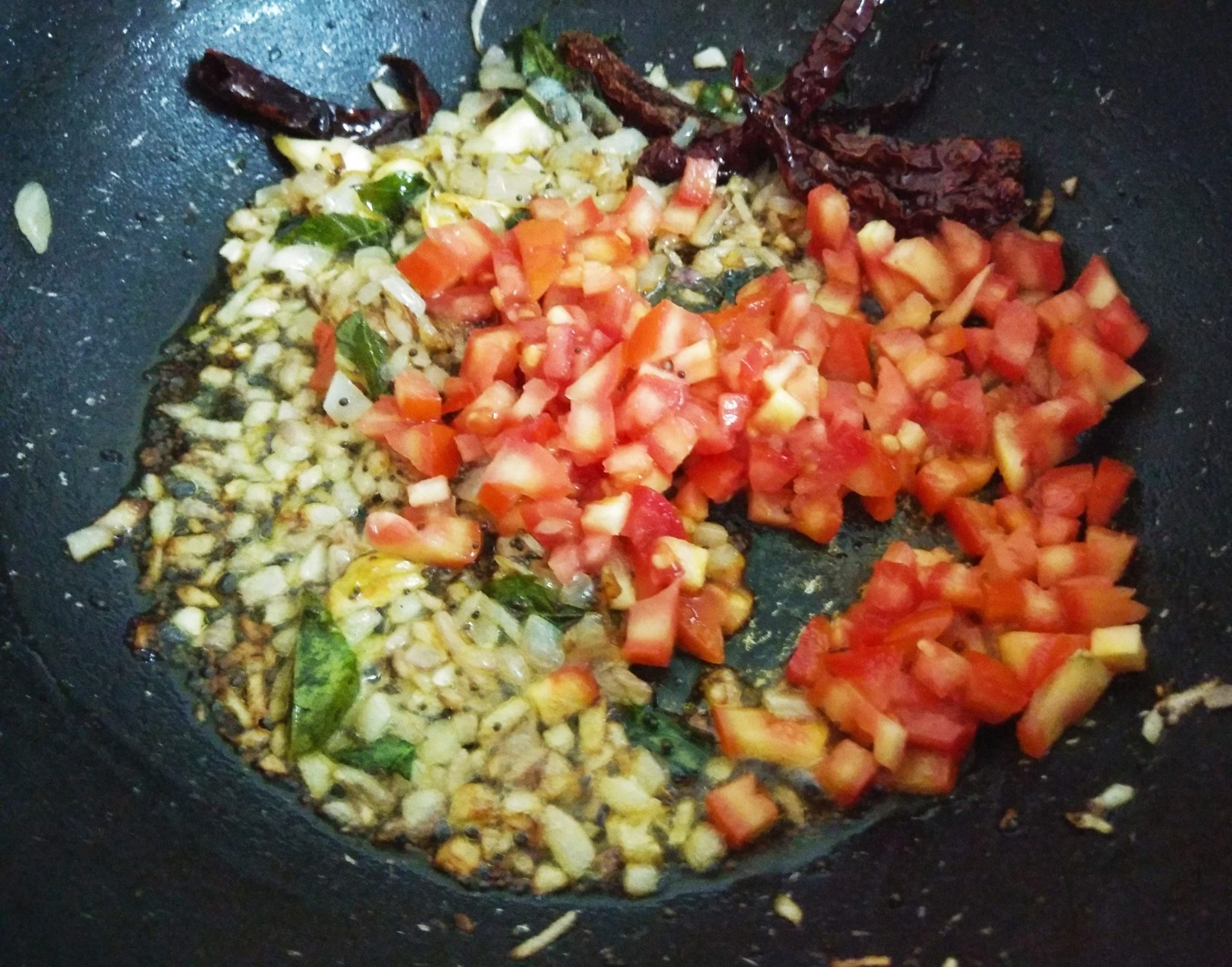 Saute onion and tomato in oil