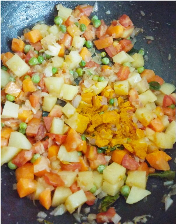 Add tomato puree to the pan