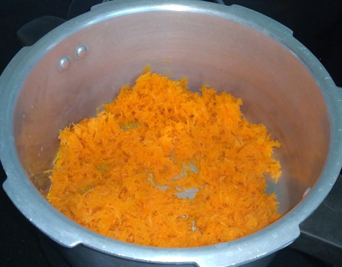 Add grated carrot in cooker