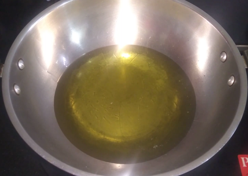 Heat oil in a pan for Deep frying