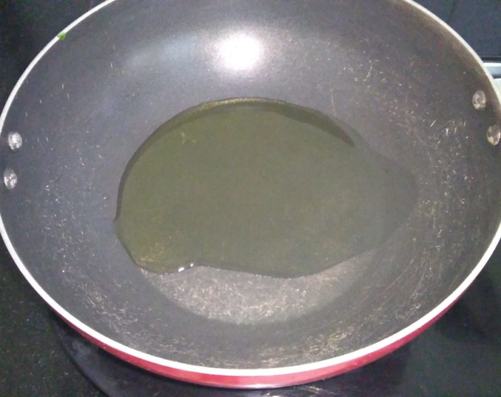 Add oil in pan