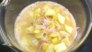 add fried potatoes and onions in egg mixture