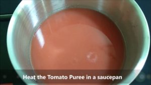 Heat the tomato puree in a pan and reduce to desired consistency