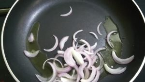 add few slices of onion and fry them in the pan 