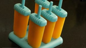 Pour Mango juice in Popsicle mould